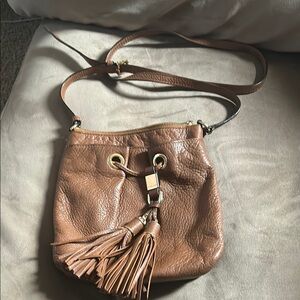 Brown Leather Satchel with Drawstring Closure and Tassel